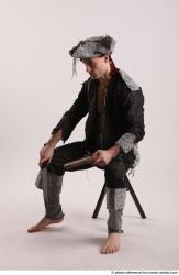 JACK PIRATE SITTING POSE WITH GUN AND DAGGER